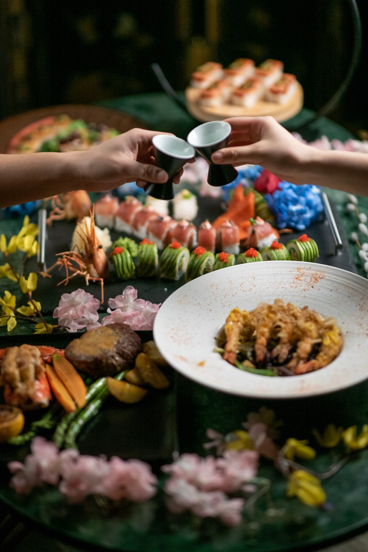 A full sushi and seafood spread laid out across the table