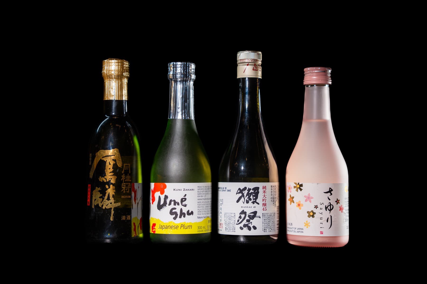 Four bottles from the Kasai sake list, including umeshu and Dassai